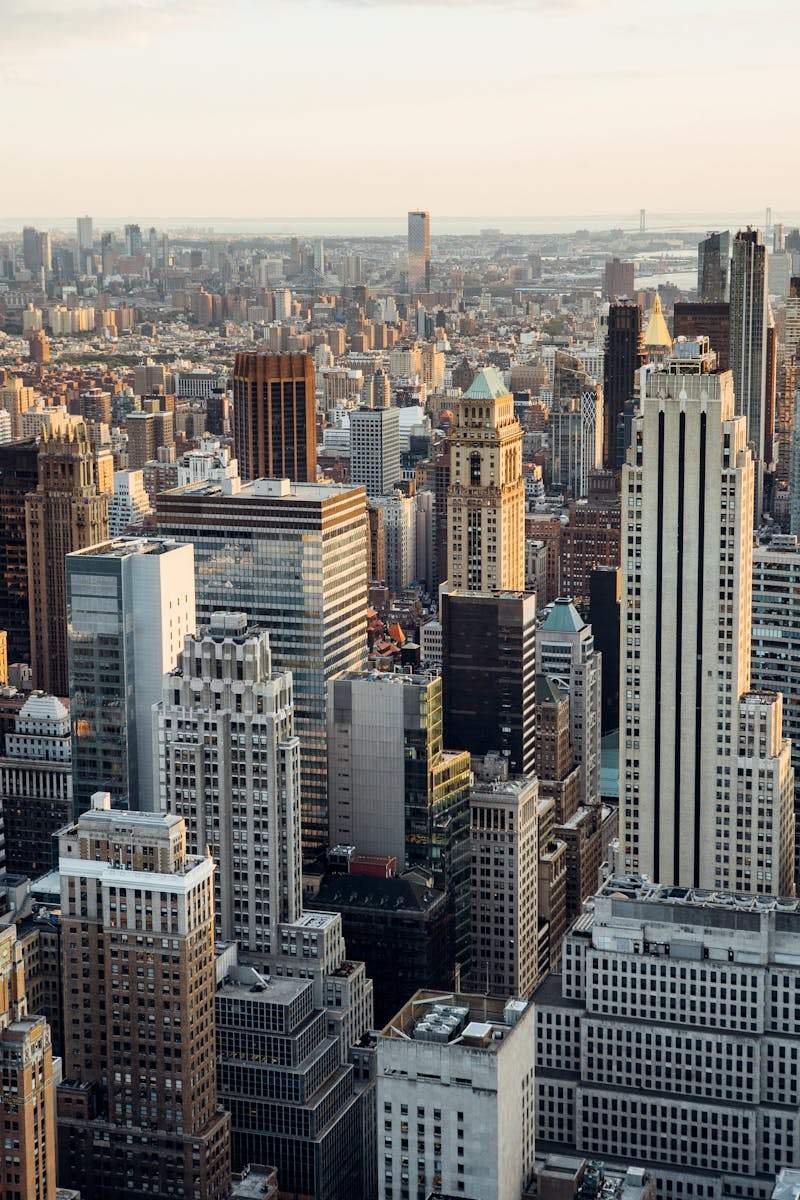 From above of downtown of megapolis with high rise financial and residential buildings located in New York City in daytime