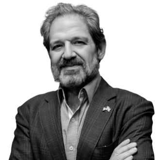 Man in suit with crossed arms, monochrome.